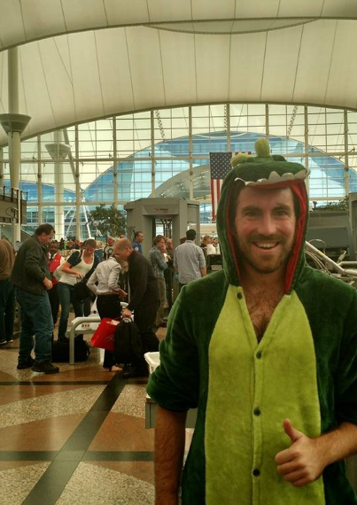 This guy who lost a bet and went through security as a dinosaur