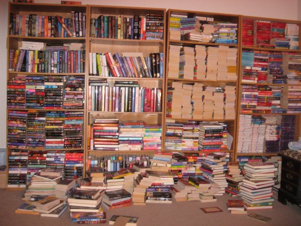 Biblioklept,
A compulsive book thief or hoarder.