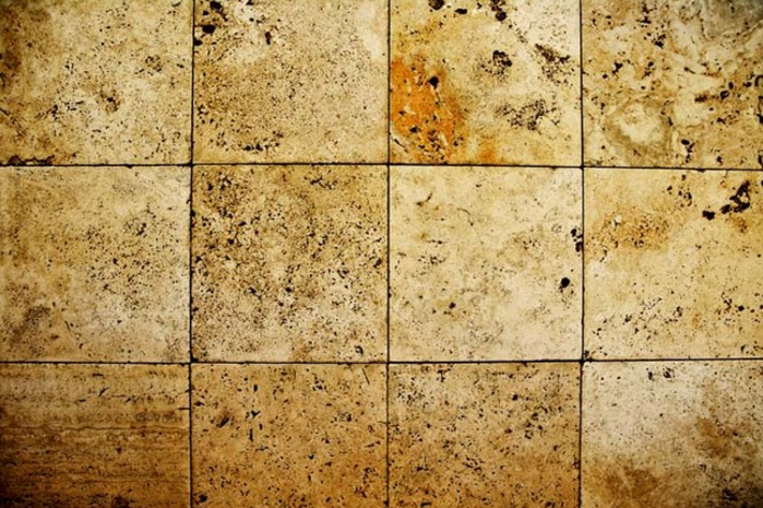 Clean your grout by pouring Coke on the floor for a few minutes. Wipe it up and your grout will be as good as new.