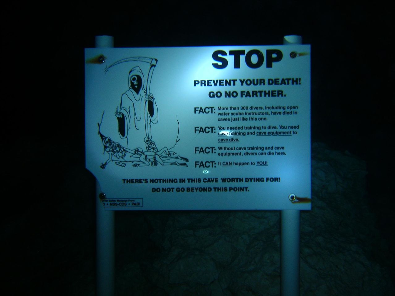 Sign outside of an underwater cave