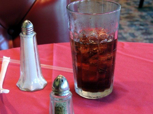 In the US, ordering your drink without ice gives you more soda or whatever it is that you ordered. The company deliberately instructs its staff to put ice in the drinks by default to cut costs.