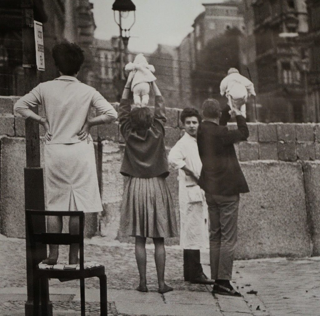 Residents of West Berlin showing their children to their grandparents who reside on the Eastern side, May 9th, 1961