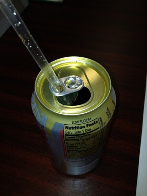 Don't let your straw pop up out of your can.

The large hole on the can cap is for your straw to enter, to keep it in place in your carbonated beverage of choice.