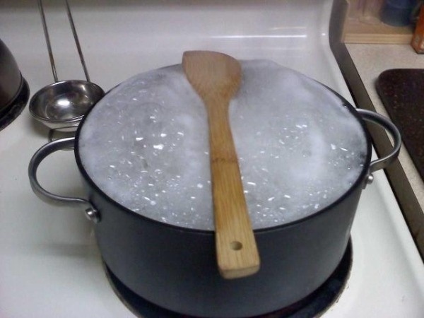 Sick of your pot boiling over?

There's a ridiculously simple solution for that, and all you have to do is place your wooden spoon over top. Seriously, that's it. The bubbles won't overflow, and everyone will think you're a damn genius.