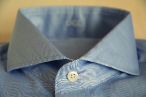 That button hole up top isn't there for no reason.

The horizontal button hole at the very top is placed there to prevent your shirt from unbuttoning on top, for the moments you want to look extra presentable.