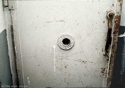 The “Judas Opening”. A peephole in the door of the gas chamber, through which guards and V.I.P.s could enjoy watching the death agonies of their helpless, defenseless victims at the Mauthausen concentration camp