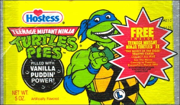 One of the rarest TMNT food products was made by Hostess from 1990-1991. The candy consisted of a green glazed pie crust and “Vanilla Puddin’ Power” inside. A commercial for the pies featured all 4 turtles, performing a rap song with the memorable line, “Fresh from the sewers to you!”