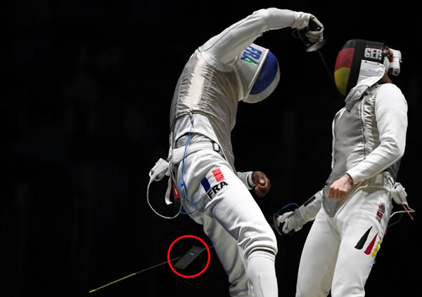 France's foil fencer Enzo Lefort was competing against Germany's Peter Joppichduring when his cell phone popped out.

Why this champion athlete slipped a phone into his pocket for this significant challenge, no one knows, but hopefully, it's not because of an emergency situation or because he's waiting for a booty call. 

Lefort calmly picked the phone up and handed it off to someone on the sidelines. It seems this wasn't enough to get him disqualified, but in the end, five-time world champion Joppich defeated Lefort.