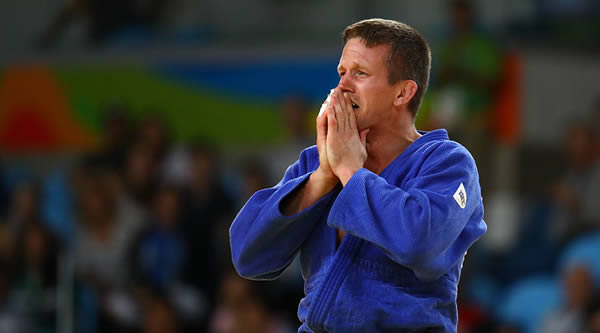 What was one of the proudest days of Dirk Van Tichelt's life ended in a trip to the hospital, after the judo medallist was assaulted on Copacabana beach. The Belgian had just secured the bronze in the 73kg judo competition and was out to celebrate. Things took a turn for the worse when he was punched in the face by a thief who stole his training partner's mobile phone. The 32-year-old, who can clearly handle himself in most combat situations, was hit as he chased the robber down the popular beach, the Belgian Olympic Committee (BOC) said. The incident only came to light when Van Tichelt appeared for media duty sporting a black eye.