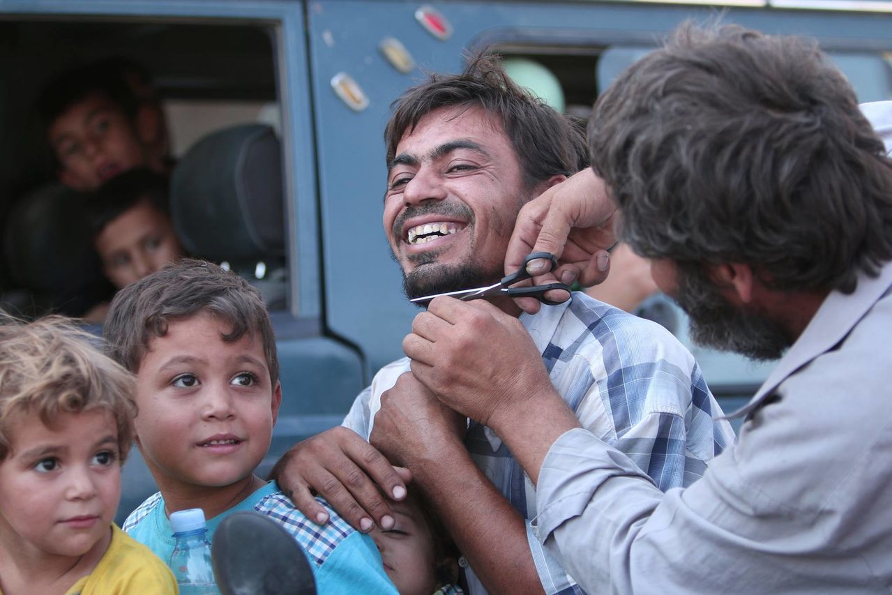 Man cuts beard after being freed from ISIS territory in Kurdistan