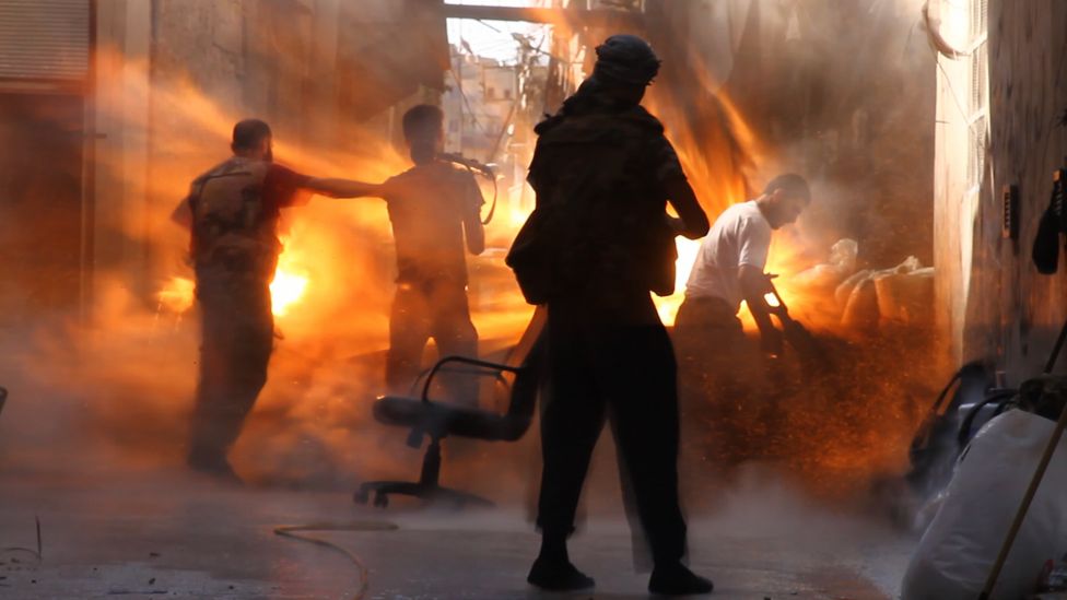 Four Syrian rebels at the exact moment they were hit by a tank shell