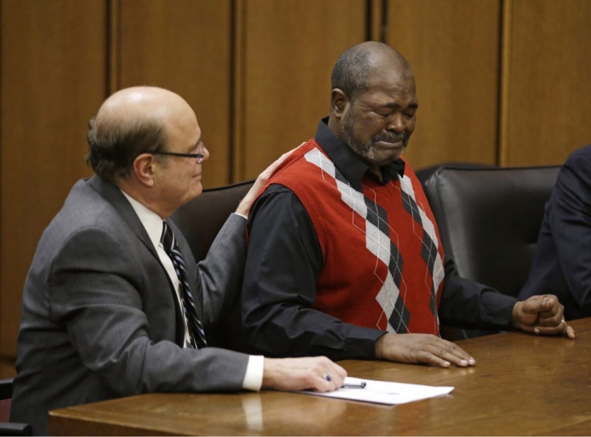 Picture of a man being told he was innocent after 40 years in prison