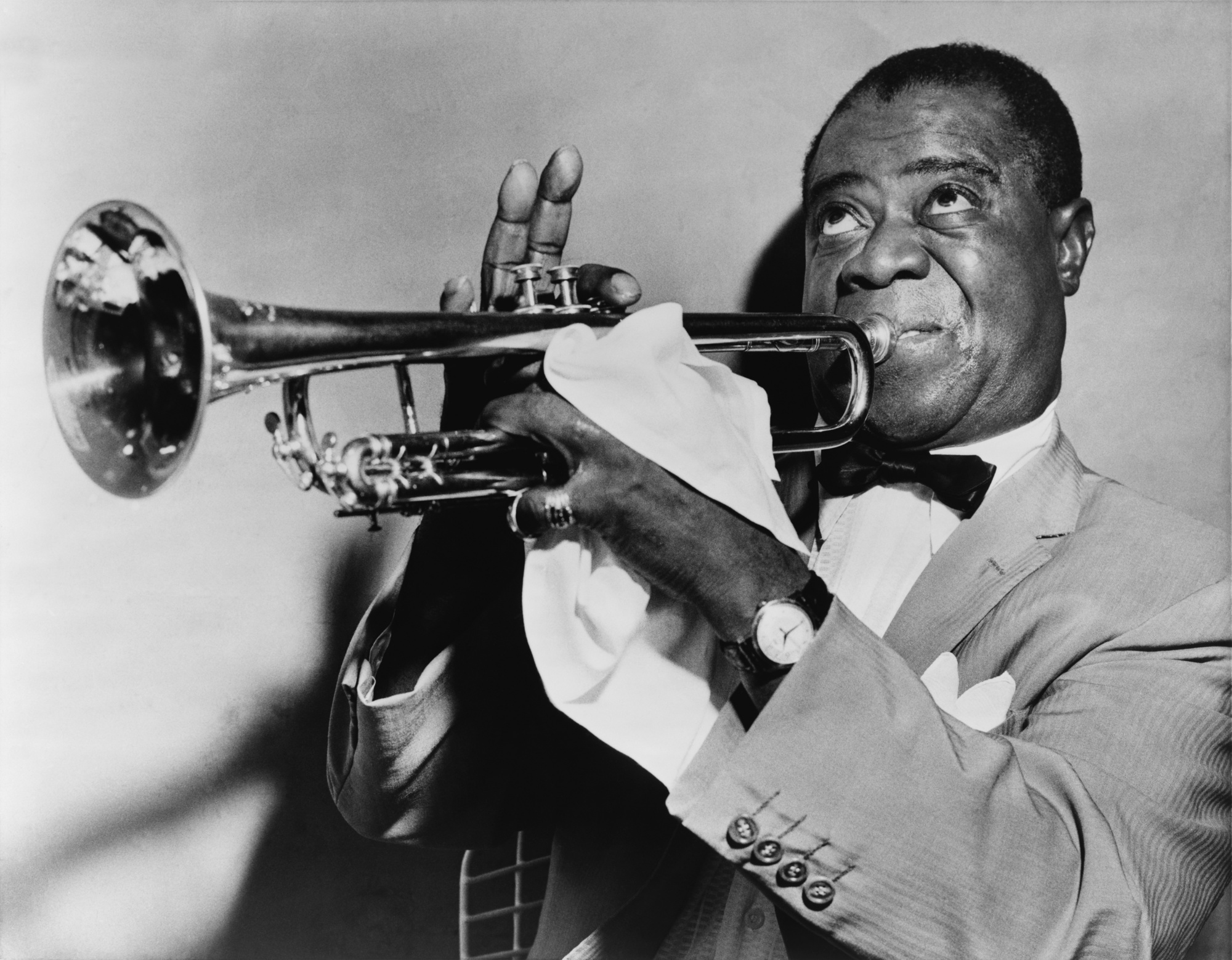 Louis Armstrong observed his birthday on July 4 and claimed that he was born in the year 1900, but his actual birthdate is August 4, 1901. The New York Times hinted at poetic license as the reason for this discrepancy.