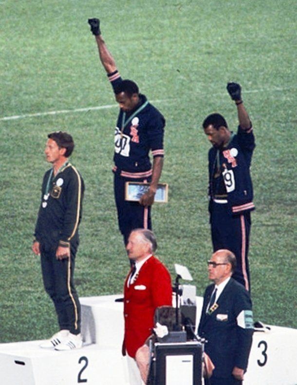 At the 1968 Summer Olympics in Mexico City, African-American sprinters Tommie Smith and John Carlos used the black power salute to show their support for human rights during their medal ceremony after having won gold and bronze medals respectively. While this act was widely perceived as noble and heroic by public, the International Olympic Committee decided to punish the athletes by stripping them of their team member status.