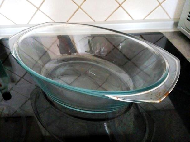Removing burnt residues from glass baking dishes might be very difficult. To make it easy, just use a ball of aluminum foil with a bit of dish soap on it.