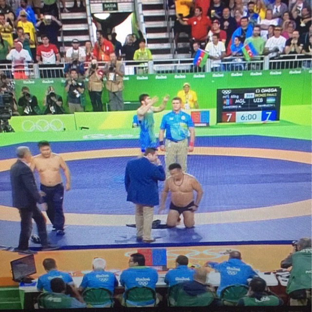 Mongolian coaches disagreed with the decision. Proceeded to strip and throw their clothes at the judges.