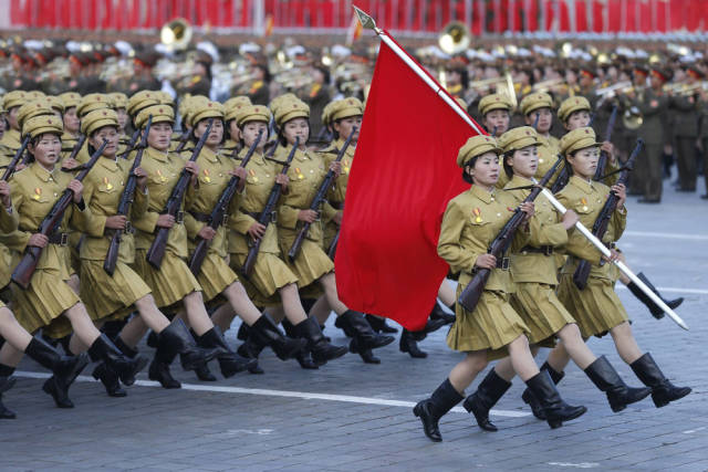 Female soldiers march in a parade to commemorate the 70th anniversary of the Worker's Party of Korea, which presently rules.