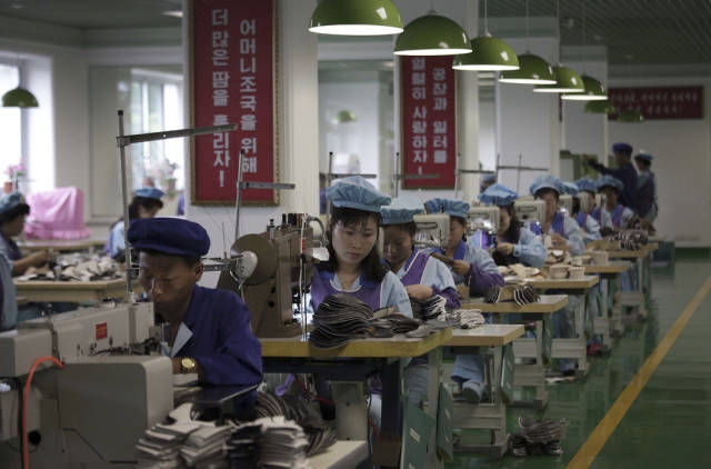 Workers at a shoe factory do their duties extra fast thanks to a 200-day "speed campaign" by the government to boost economic output and the standard of living.