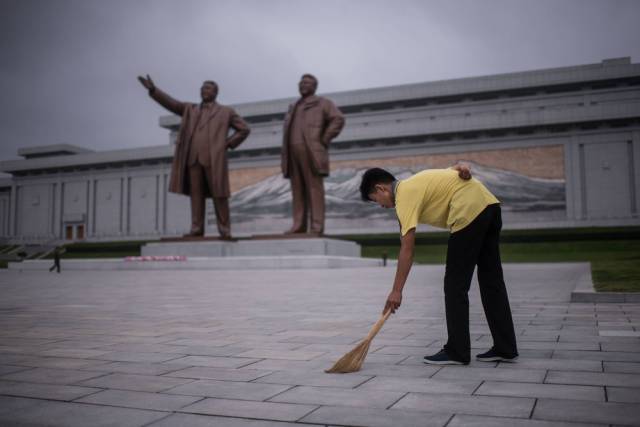 Residents often "volunteer" (not always voluntarily) to maintain the many public spaces meant to honor the current and former rulers of the nation.