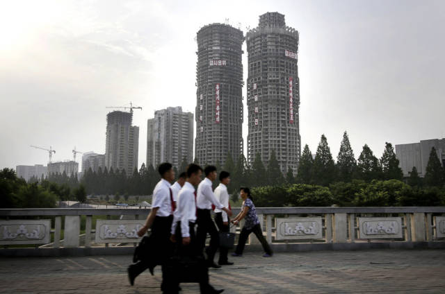 Here is a new development known as Ryomong Street, containing two 70-story buildings, a 50-story one, and several smaller towers. It’s built to falsely represent the economic health of the country, and is actually built by soldiers who double as construction workers.