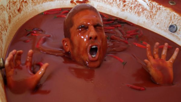 For his latest stunt, daredevil Cemre Candar thought it would be a good idea to take a bath in a tub filled with the equivalent of 1,250 bottles of hot sauce. He was wrong. As you'll see in the video below, he went so far as to consume hot peppers and dunk his head in the mixture. The result was overwhelming misery. Hours later, after cleaning off, Candar showed off his red blotchy skin and explained that he was still feeling the horrible burning sensation.