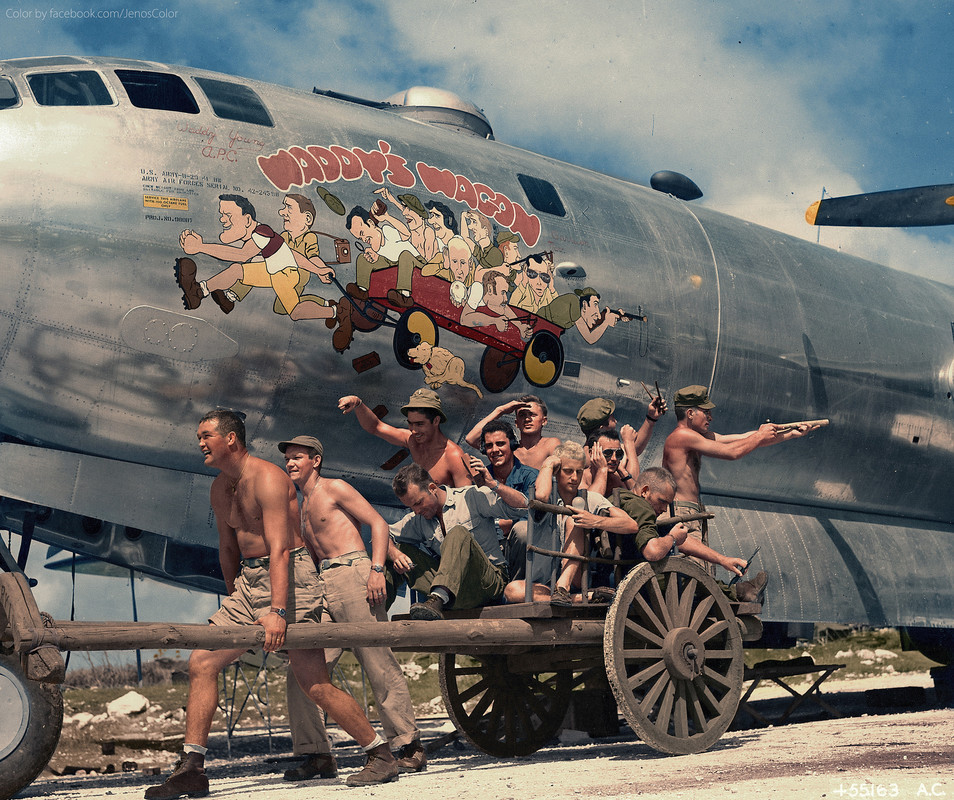 Captain Walter “Waddy” Young and his crew pose in front of their caricatures on their B-29 Superfortress , November 24, 1944