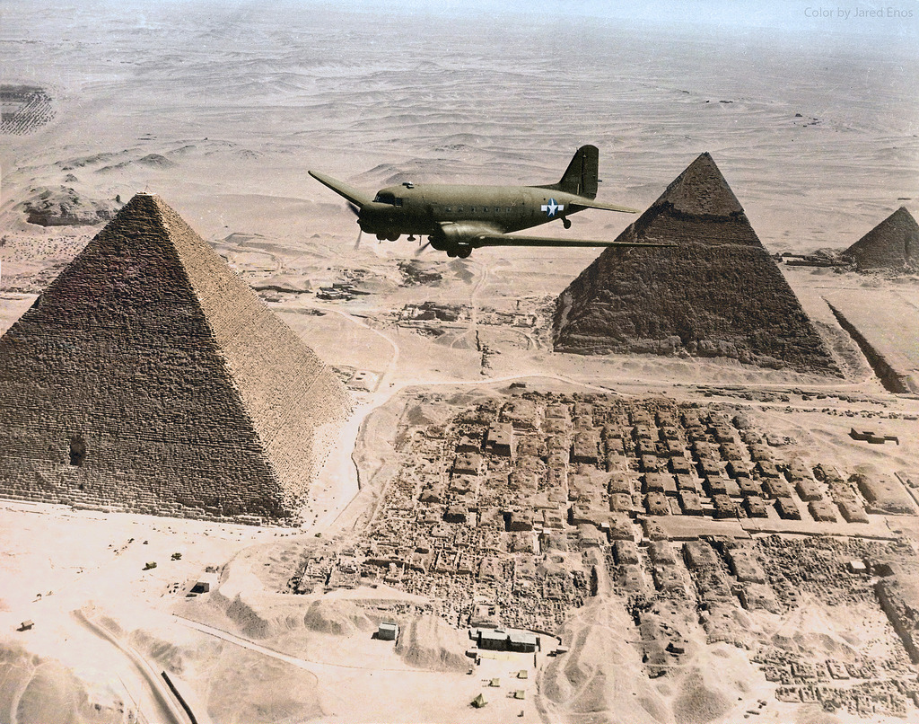A U.S. Army Air Forces Douglas C-47 Skytrain flies over the Giza pyramids in Egypt, 1943