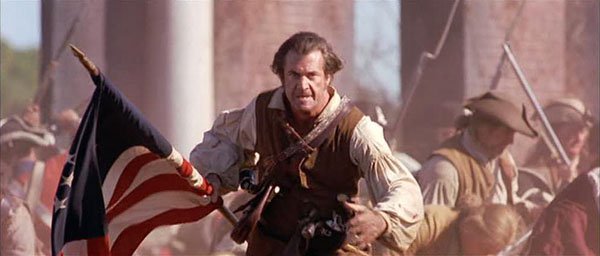 The Patriot.
Another Mel Gibson film that bends actual events to a near breaking point. This film about the American Revolution follows Benjamin Martin as he leads the Colonial Militia after his son is murdered by a British officer. The film has a rather unfair representation of the British Soldiers. This is fairly obvious in the scene where the soldiers burn the elderly, women and children to death inside a church. Jason Isaacs’s evil British colonel was based on the historical figure Col. Tarleton, and there’s no real evidence that he ever broke the rules of engagement, let alone shot a child in cold blood.
Gibson’s character was based on someone called Francis “The Swamp Fox’ Marion, who hunted Native Americans for sport and raped his female slaves. He also didn’t have his children until after the war — when he married his cousin. So next time you watch it’s probably a good thing to keep in mind that it’s almost entirely a work of fiction, albeit entertaining fiction. I mean nothing exemplifies its disregard for the true like the final battle of Guilford Court House, where Martin defeats his nemesis. In reality, the Americans lost that skirmish.
