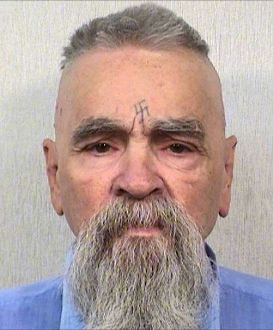 Cult leader Charles Manson with tattoo of Swastika on his head