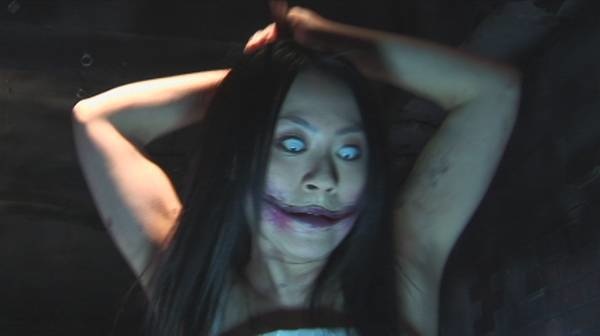 Kuchisake-onna, or Slit-Mouthed Woman, is Japanese urban legend with many versions. The common denominator is that each story features a woman with a mutilated face, slit from ear to ear, that haunts the public.

A common version says that her husband found out about her infidelity and slit her mouth asking 'Who will find you beautiful now?' Others say that the wound was self-inflicted or that she was from a mental asylum.

According to the original legend, the woman was believed to have approached her victims with a mask asking, 'Do you think I'm pretty?' She then removes the mask and asks them again, but unfortunately a 'Yes' or 'No' would end in their death.

The modern urban legend has the woman wearing a surgical mask. She asks the same question. If you say no the first time, the victim will be killed with scissors. If you say yes, she'll reveal her face and ask again. If you say no this time, she'll cut you in half. If you say yes, she'll make your face look just like hers.

This urban legend made some people so fearful that they would prepare ambiguous answers, among other 'solutions,' to avoid such a grisly fate.