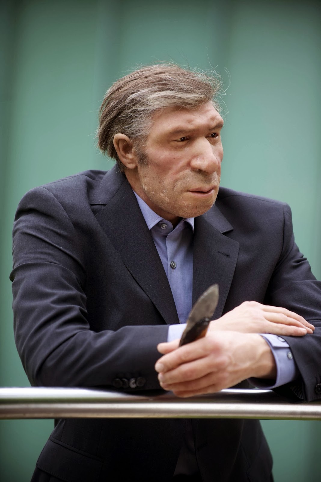 This is a Reconstruction of what a Neanderthal might look like today, suit and all