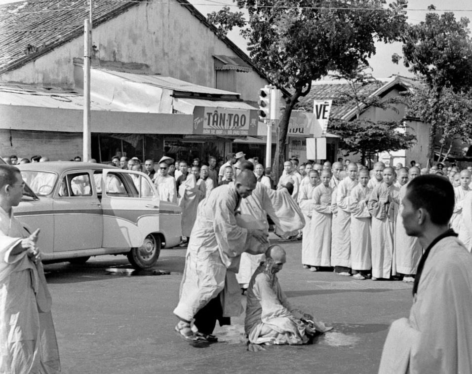 Thích Quảng Đức, moments before the inferno, 11th June 1963.

I was to see that sight again, but once was enough. Flames were coming from a human being; his body was slowly withering and shriveling up, his head blackening and charring. In the air was the smell of burning human flesh; human beings burn surprisingly quickly. Behind me I could hear the sobbing of the Vietnamese who were now gathering. I was too shocked to cry, too confused to take notes or ask questions, too bewildered to even think … As he burned he never moved a muscle, never uttered a sound, his outward composure in sharp contrast to the wailing people around him.
David Halberstam of the NYT recalling the event