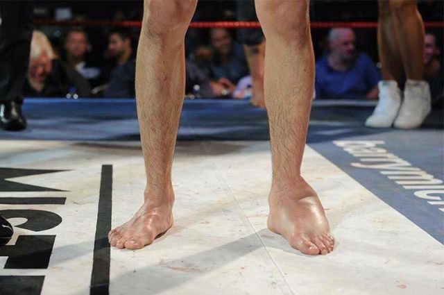 MMA Fighters Kicking Foot