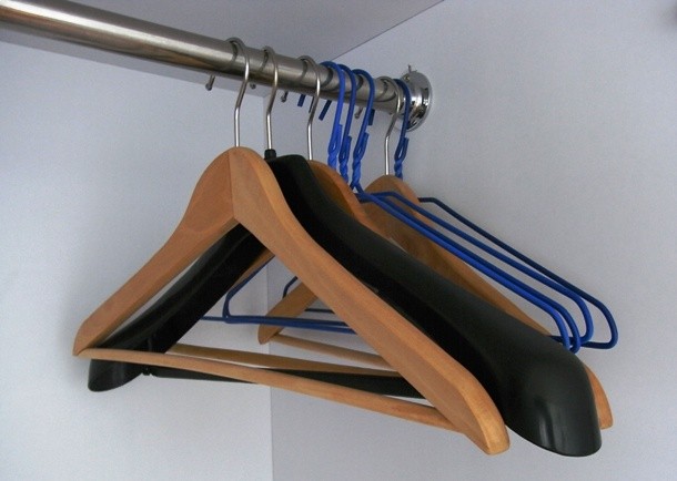 Clothes hangers do not have to hang clothes only. By adding a few eyelet screws, it can be turned into a handy jewelry organizer or a shoe holder.