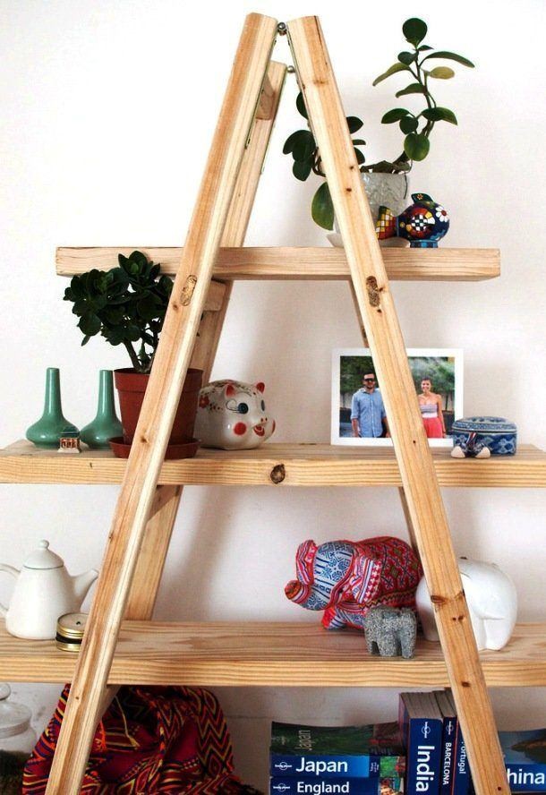 Ladders can be used for more than just helping you reach higher. Fitted with a few boards, it can also serve as a stylish shelf.