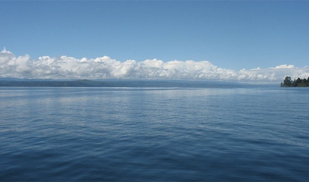 Lake Taupo. It is New Zealand’s largest lake, and it is also the crater rim of what scientists believe was the largest volcanic eruption on Earth (Oruanui eruption 26,000 years ago). It’s just a matter of time…