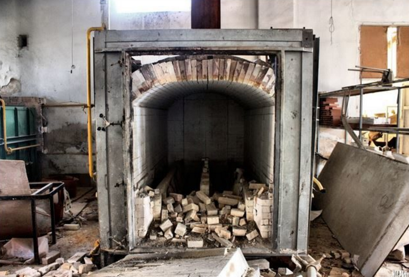 This furnace was used to bake the porcelain. It looks like a few doll parts never made it out.