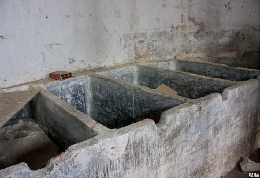These served as washing bins for the parts, but they look more like makeshift graves.