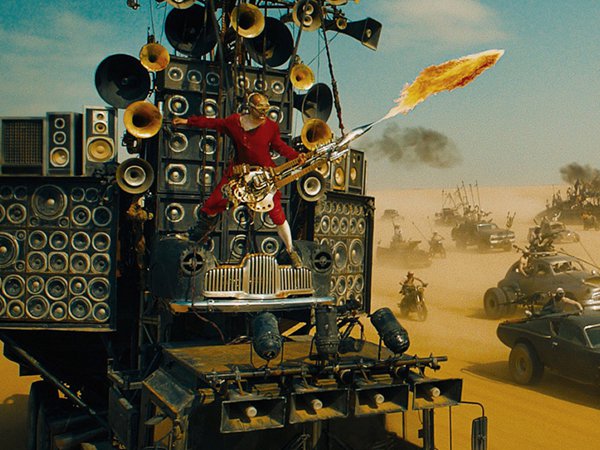 Mad Max: Fury Road.
The flame-shooting guitarist is Australian artist/musician Sean Hape, better known as Iota. In an interview on Vice (2013), he said the guitar weighed 132 pounds, and shot real gas-powered flames, which he controlled using the whammy bar.