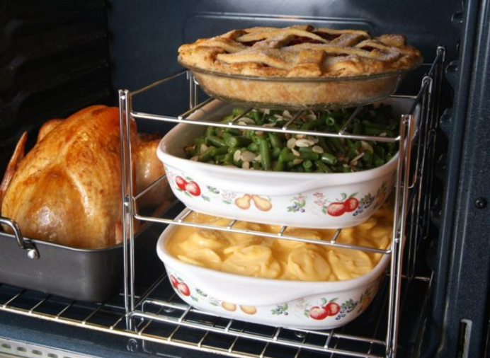 Don't waste hours cooking dinner one step at a time. This three-tiered oven rack can cook everything at once.