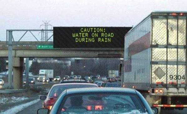 highway sign hacked - Caution Water On Road During Rain 9304