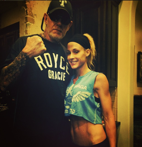 The Undertaker and his wife, former WWE Diva Michelle McCool, outside the ring