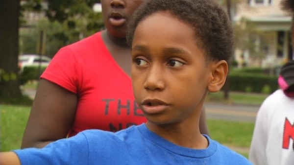 10-year-old Treymel Mitchell claims a clown approached him on Syracuse, New York's north side. Afraid he was going to be kidnapped, he ran away, hid between two nearby houses and called 911 for help. 

Mitchell says he was walking to school when he noticed something out of the corner of his eye. "I saw a clown who was peeking through the bushes," he recalled. He said when he tried to get a better look at the figure that was looking back at him, "that's when it walked out and started making hand gestures at me, and it started staring at me."

When police arrived, there was no clown in sight, but several other kids said they had seen people dressed as clowns in the area. Law enforcement has detailed descriptions of three suspects who may have been harassing the kids and say there will be consequences for those suspects if they're found.