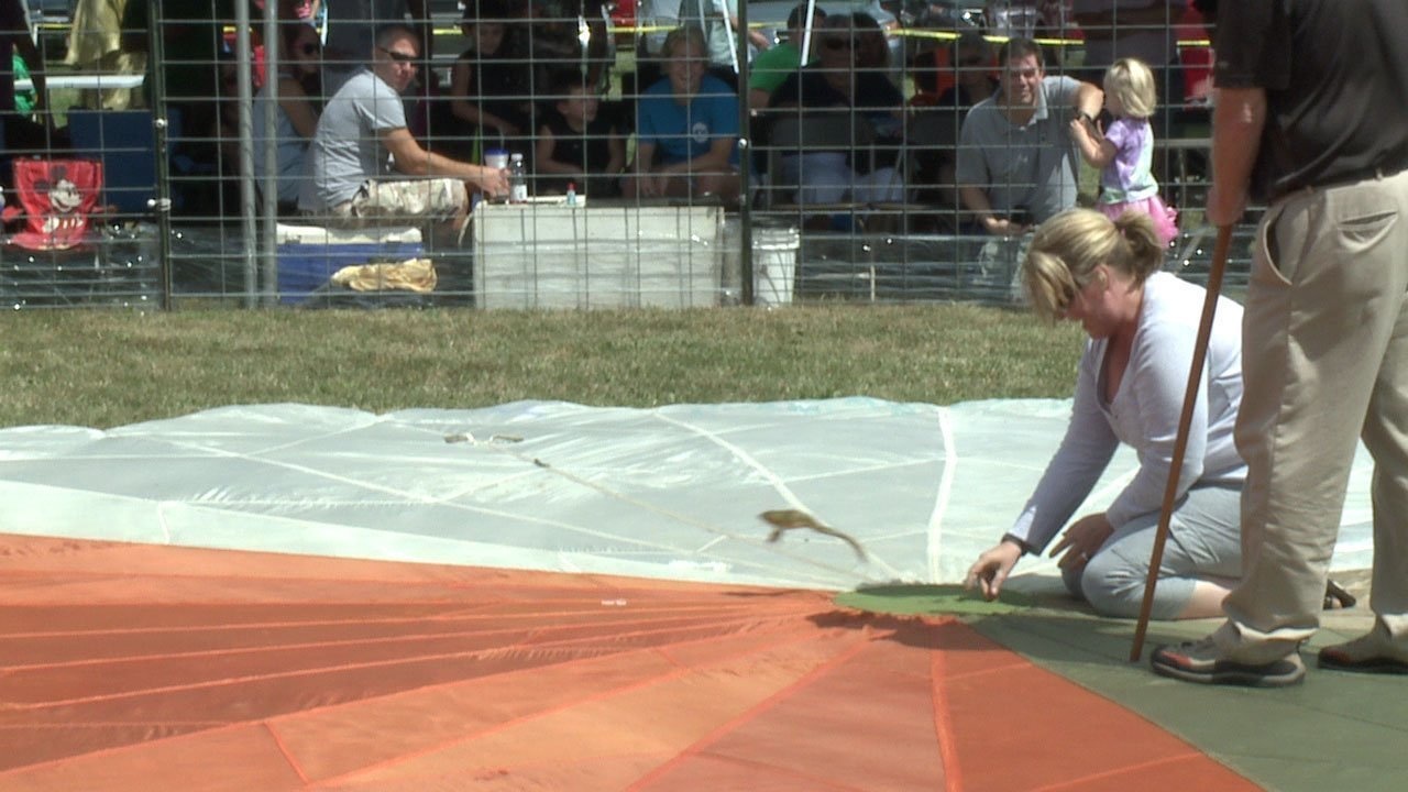 Not only did they go to a frog jump festival, they had to cut it short because his wife, who has a restraining order against him, showed up as well.