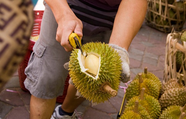 If you want your party to smell like the pits of hell, durian is a good way to go. While the fruit looks intimidating with its spiky exterior, it's the smell that makes it scary. Durian smells so bad that in many parts of Asia, you cannot carry them on public transportation or take them into a hotel. The fruit has a high sulfur content, but an incredibly rich, savory and sweet flavor that is challenging to the palate — you'll find that most people who have eaten the fruit either love it or hate it.
Durian can be found at most Asian markets and some major chain markets as well. The fruit can also be ordered online. Just cut up the fruit and just plate it raw to serve.