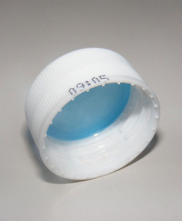 Plastic Liners Under Bottle Caps.
Check out the blue liner. This pressure seal is softer than the plastic used for the rest of the bottle and helps ensure the freshness and carbonation of your drink.