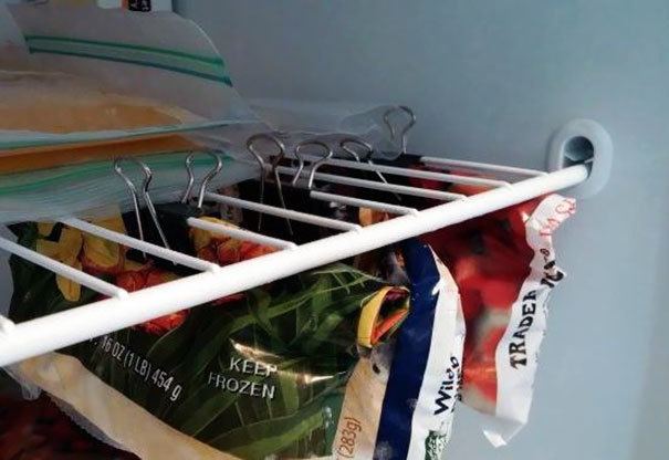 Fridges and freezers can easily get filled up. Maximize your space by using binder clips to clip some of your bagged food items to the shelves.