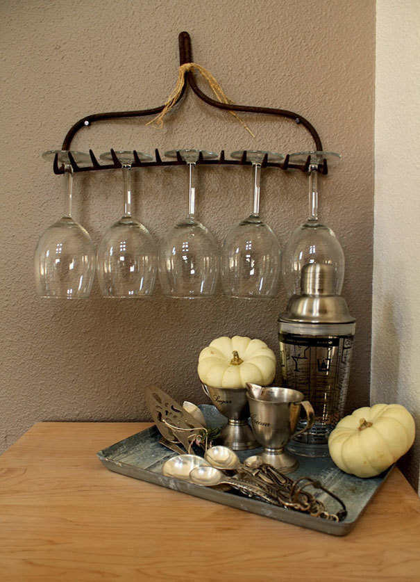 If you have an old rake you no longer use, transform it into a wineglass holder.
