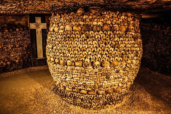 Catacombs of Paris.
5 stories under the streets of Paris you’ll find the remains of over 6 million Parisians. These catacombs are the result of bodies being thrown underground due to cemeteries being filled to capacity. In 1810, the remains were organized and the underground mines were turned into a mausoleum.