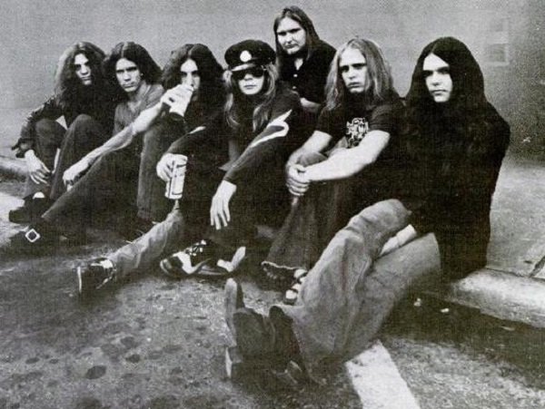 Lynyrd Skynyrd.
The origin of this band’s name is pretty awesome. When band members Ronnie Van Zant, Gary Rossington and Allen Collins were in high school, their gym teacher, Leonard Skinner, constantly gave them shit for having long hair and backed the policy against boys having long hair. So, the name was made as a little mocking gesture to good old Lenny.